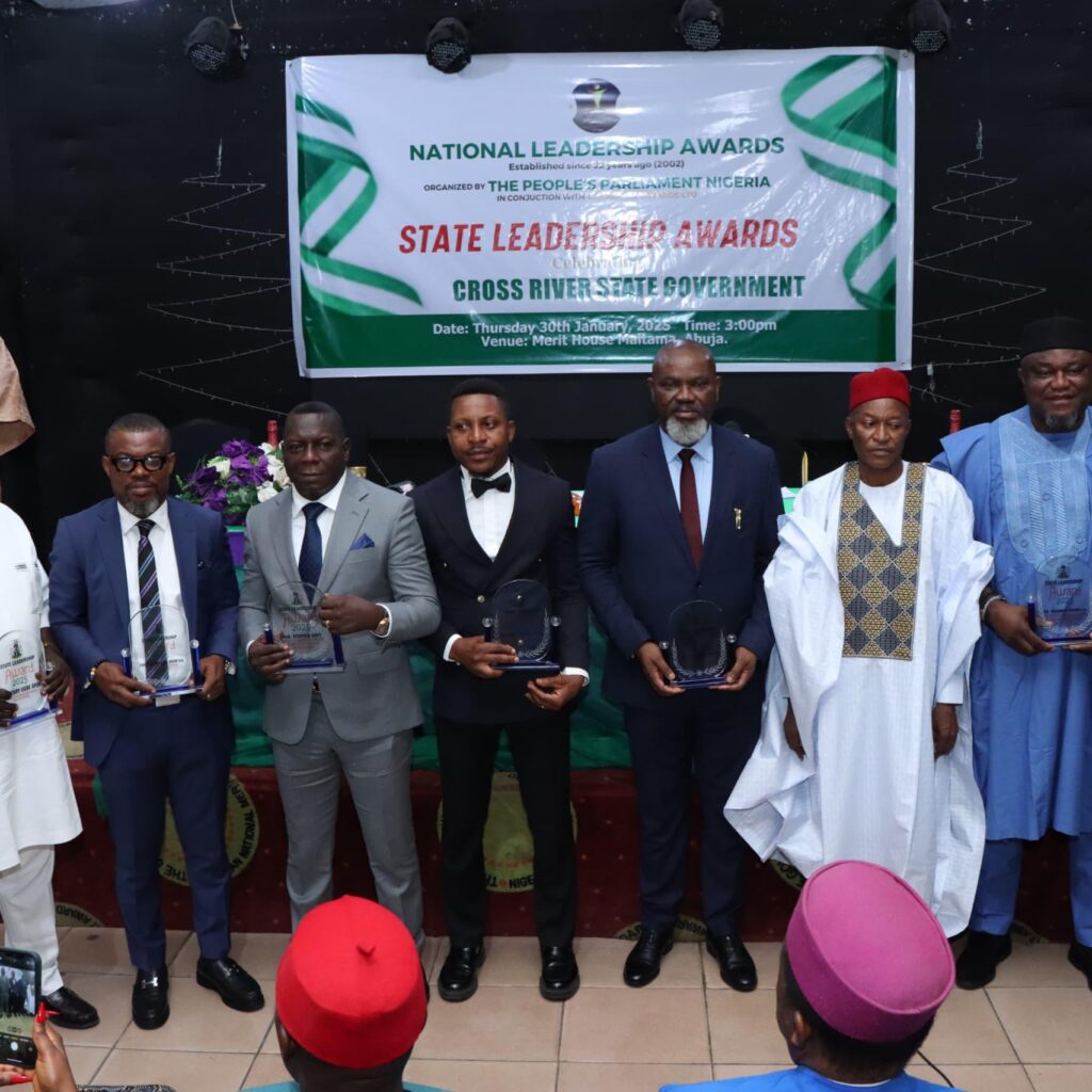 Emmanuel Ironbar in a group photograph with other awardees from CRS